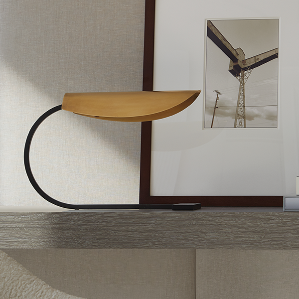 a table with a chair and a picture frame on the wall