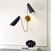 a pair of black and gold lamps