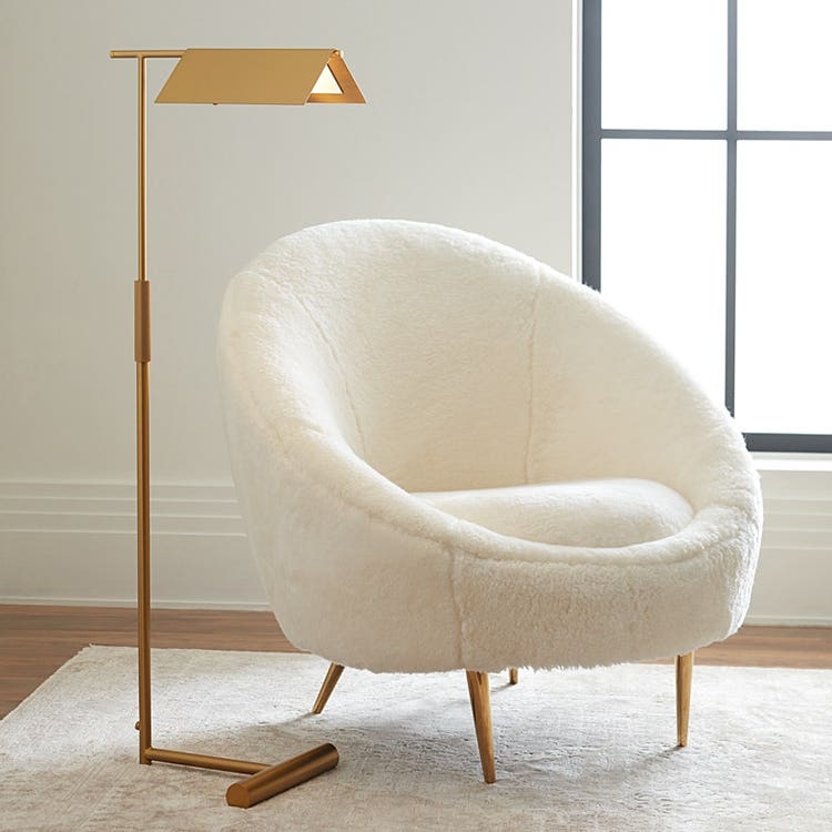 a white chair with a lamp