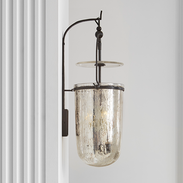 a metal bell on a wall