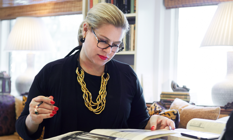 A person reading a magazine Description automatically generated