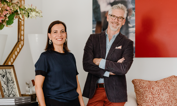 A person and person standing next to each other Description automatically generated